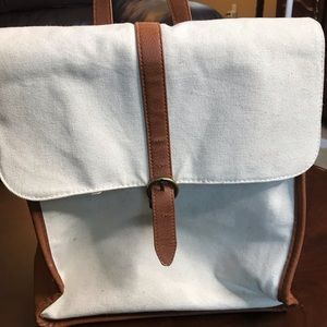 White and brown backpack